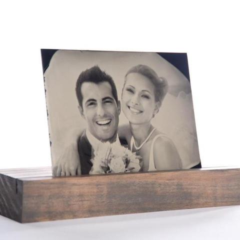 Tintype portrait of a married couple on a wooden stand